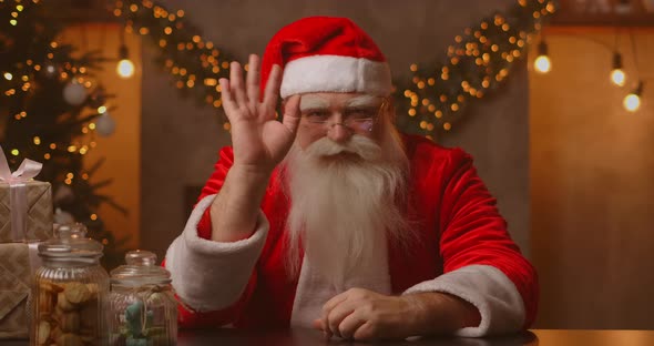 Headshot Looking at the Camera Happy Old Bearded Santa Claus Wearing Costume and Waving Hand Video