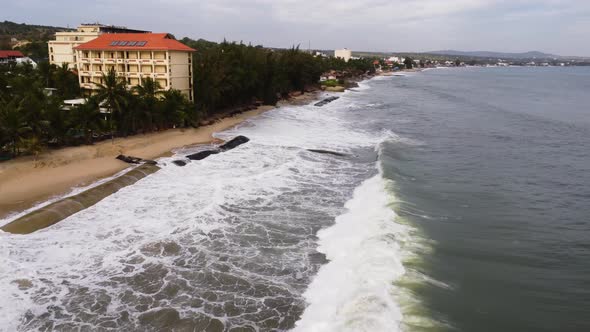 An aerial shot of geotubes protecting beach from sand erosionrising sea level