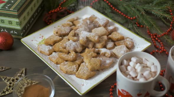 Powdered Sugar Falls on Christmas Cookies. Christmas Sweets Background. Slow Motion