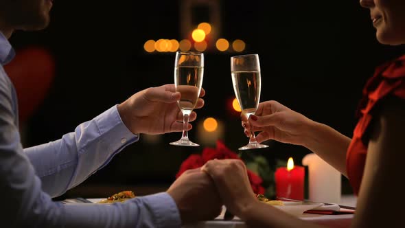 Couple Drinking Champagne in Restaurant, Romantic Date on St Valentines Day