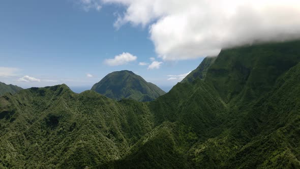 Top down aerial view of mountains, Pacific Ocean in the background, Maui, Hawaii