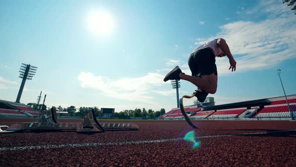 Slow Motion of a Paralympian Jogging at the Stadium