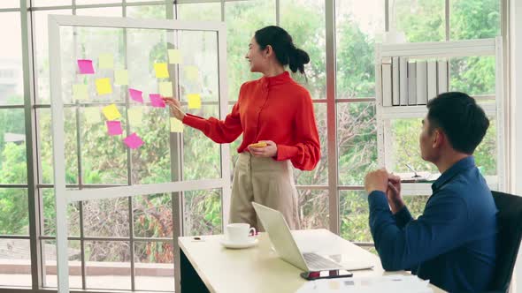 Business People Work on Project Planning Board