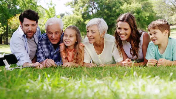 Multi-generation family taking selfie on mobile phone