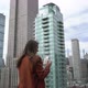 Young Woman on Rooftop Taking Picture on Film Instant Camera at New York City - VideoHive Item for Sale
