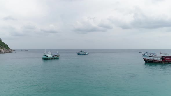 Ships In Bay under Storm Clouds