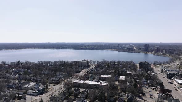 push in drone aerial shot of a lake in the spring time in minnesota