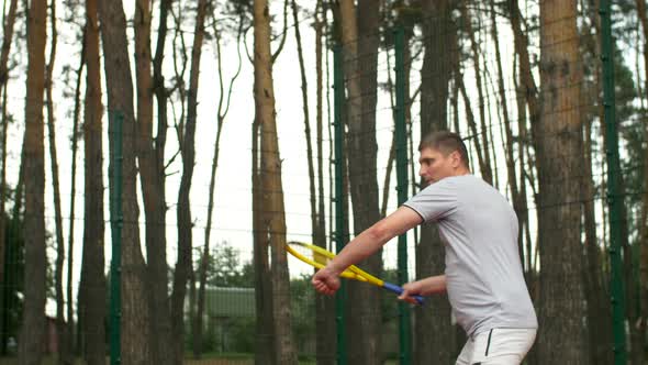 Tennis Player Hitting Forehand in a Tennis Game