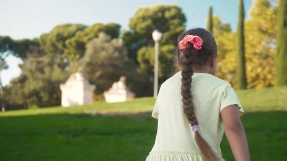 Little Girls Running in a Hedge Maze Two Sisters Kids Hold Hands and Run in Big Green Labyrinth in