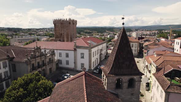 Aerial rotation left to right reveal Medieval Chaves downtown, old buildings rooftops