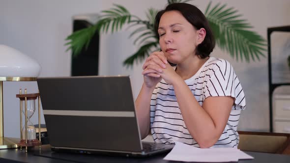 Frustrated Businesswoman Works at Computer From Home