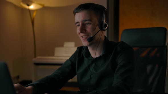 Online Support in Home By Smiling Confident Caucasian Male