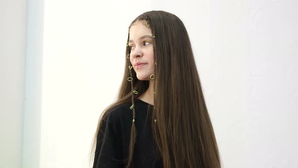 Portrait of a Beautiful Schoolgirl Girl with Long Straight Hair She Looks Away