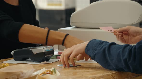 Cashier Gesturing While Customer Doing Nfc Payment Contactless Payment on Music Festival Event Food