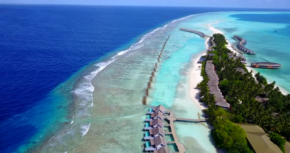 Luxury aerial abstract shot of a sunshine white sandy paradise beach and aqua blue ocean background 