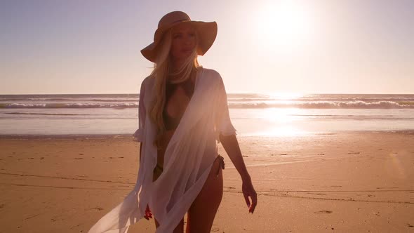 Attractive Blond Woman Walking on the Beach