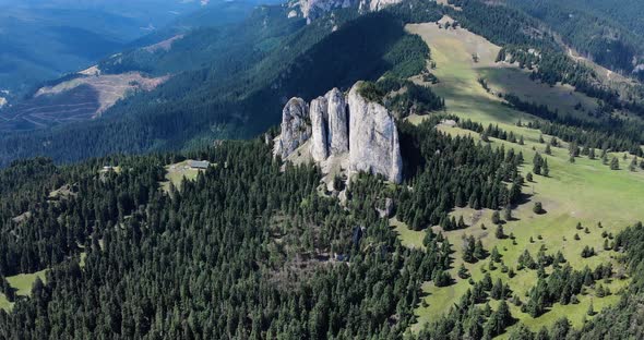 Bird's Eye View Of Unique Rock Formation Of The Loney Rock With Evergreen Forest