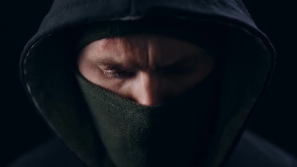 Close Up of Bad Guy Wearing Black Mask and Hood