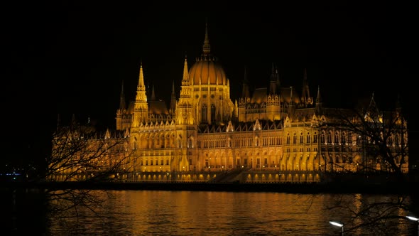 Parliament building of  Hungary located in Budapest by night 4K 2160p UltraHD slow pan footage - Riv