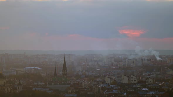 Bright Orange Sunset Over the City with Building Silhouette