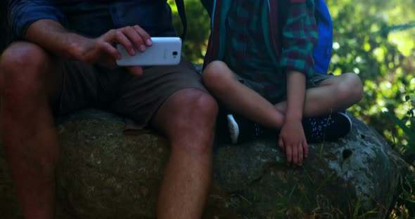 Father and son interacting with each other in the park