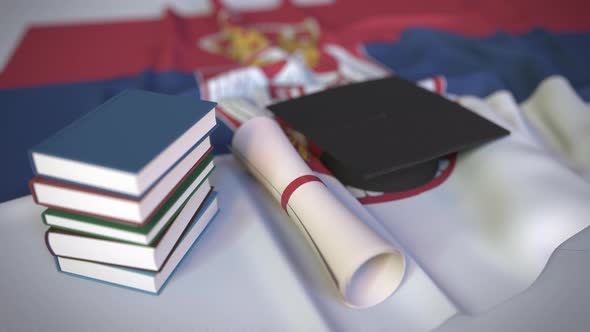 Graduation Cap and Diploma on Flag of Serbia