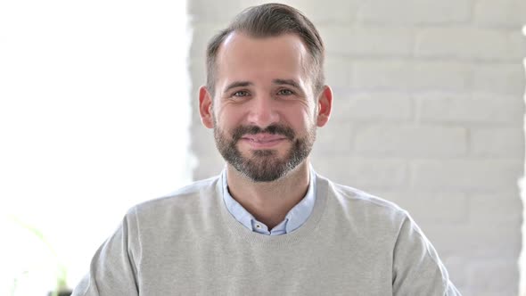 Portrait of Happy Young Architect Smiling at Camera