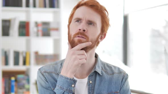 Portrait of Thinking Casual Redhead Man