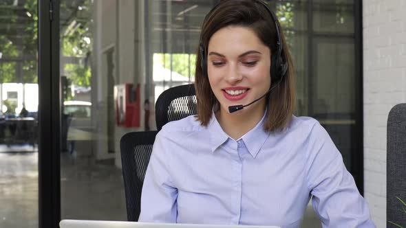 Call Operator Businesswoman Wears Headset Customer Service Manager Looking and Speaking to Webcam