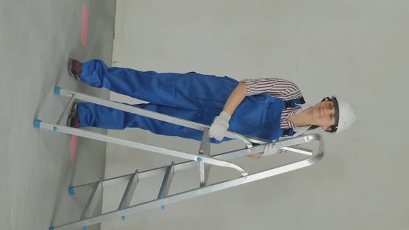 Female with Ladder Prepares for Renovating House