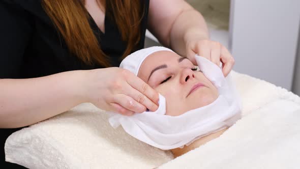 Young Woman Lying on a Stretcher in an Aesthetic Center Performing Beauty Treatment and Facial