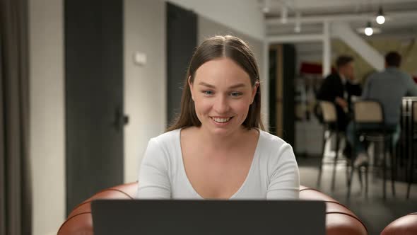 Female office worker chatting on zoom with work colleagues or clients