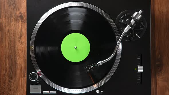 Black Vinyl Background with Green Label
