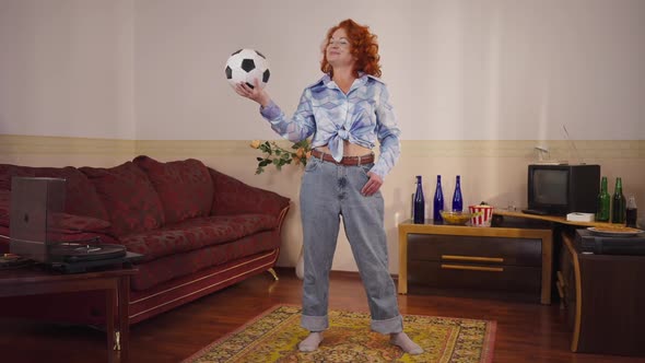 Wide Shot Confident Retro Woman Posing with Soccer Ball Indoors at Home in 1980s 1990s