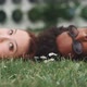 A young couple relaxing and lying on the grass - VideoHive Item for Sale