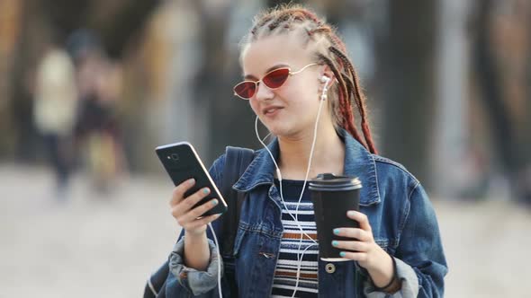 Girl Having Videochat in Street