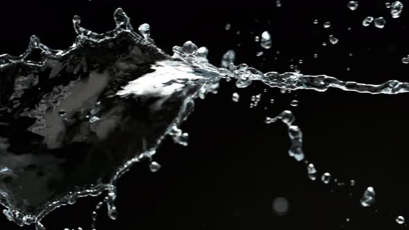 Super Slow Motion Shot of Spiral Water Splash Isolated on Black Background at 1000Fps alt
