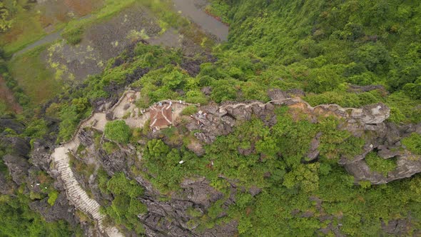 Aerial Shot of the Small Temple and a Dragon on the Top of Marble Mountain Mua Cave Mountain in Ninh