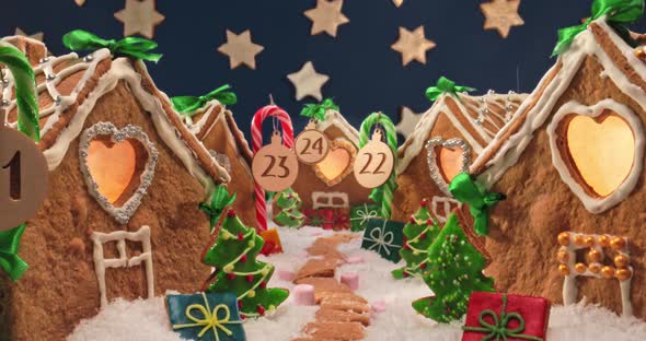 Gingerbread cottages at night with stars. Gingerbread village for Christmas.