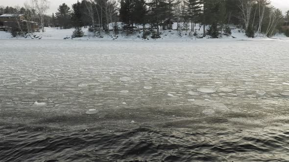 Freezing lake surface within wilderness 4K