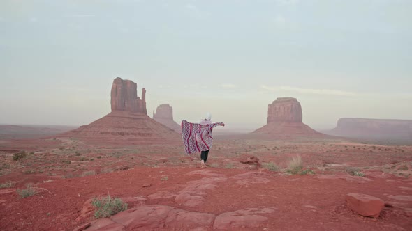 Happy Laughing Female Running Scenic Red Landscape Dancing in Monument Valley