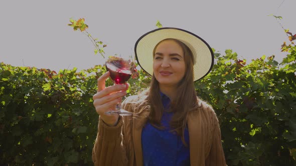 Happy Woman Winemaker Tasting Red Wine