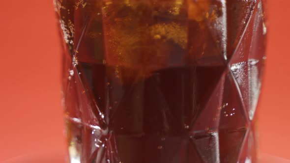 Coke glass full of ice. On the turntable.