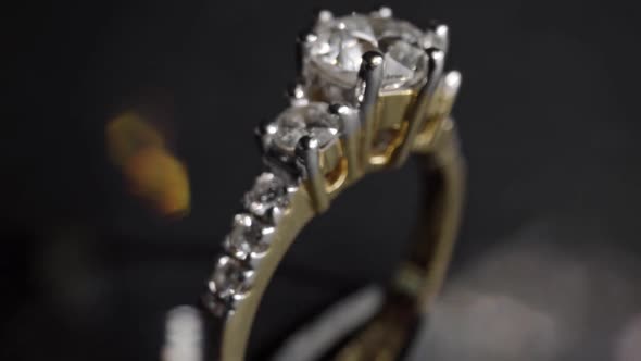 Extreme Detailed of Diamond Ring Close Up Shot While Rotating on Dark Background