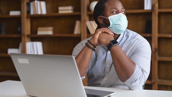 An AfricanAmerican Male Office Employee Wearing Medical Mask Indoor