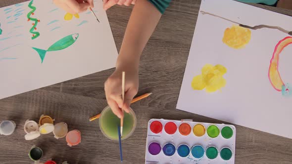 Mother and Son with Colors Drawing at Home