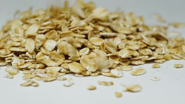 Oatmeal Falls From Above on a White Background. Healthy Food, Agriculture and Manufacturing.