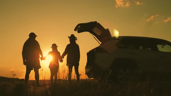 Silhouette the Happy Family of Four People, Mother, Father and Two Children Are Happy Sitting in the