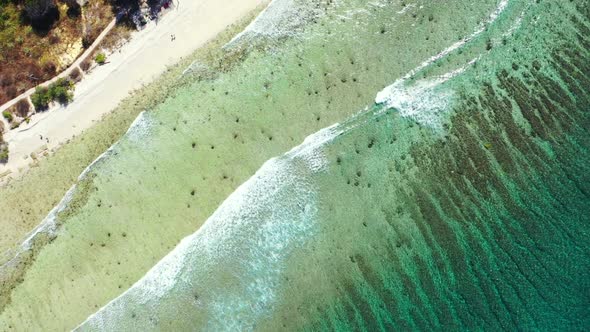 Aerial flying over landscape of paradise tourist beach time by blue green lagoon and clean sand back