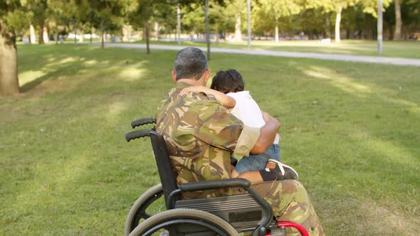 Disabled Soldier Dad Playing with Kids in Park